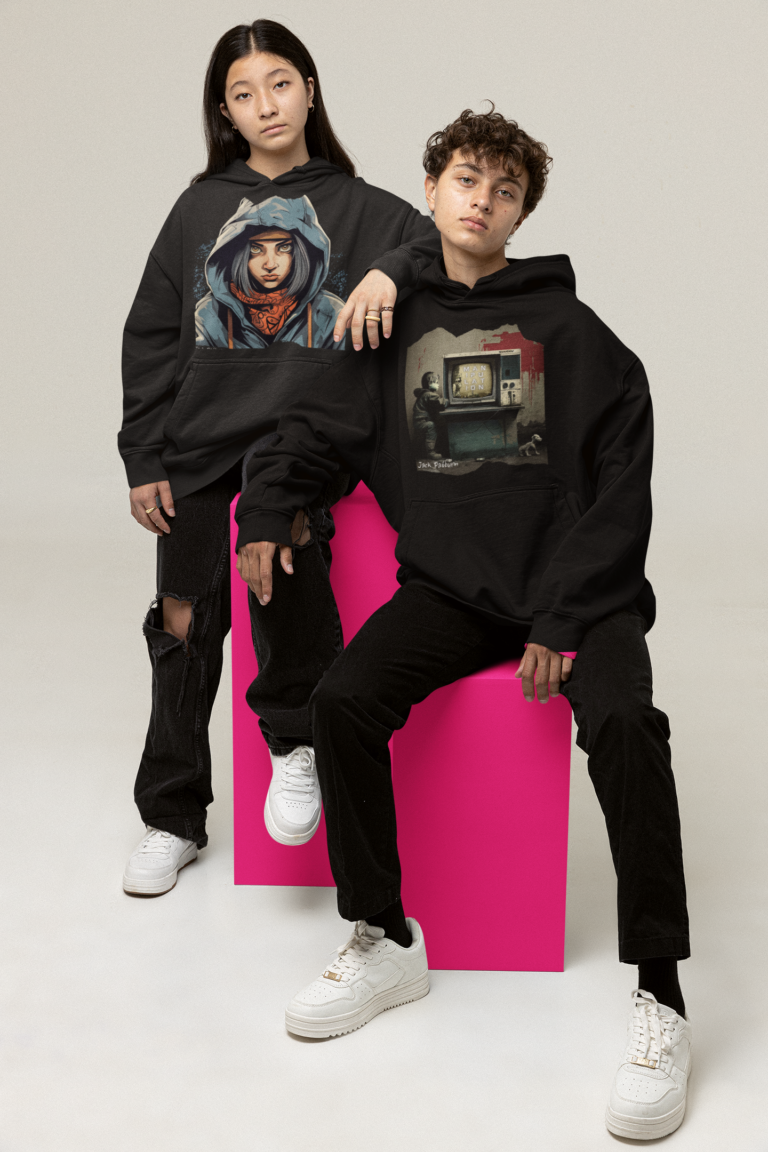 oversized-hoodie-mockup-of-a-serious-couple-sitting-in-cubes-at-a-studio-m26223